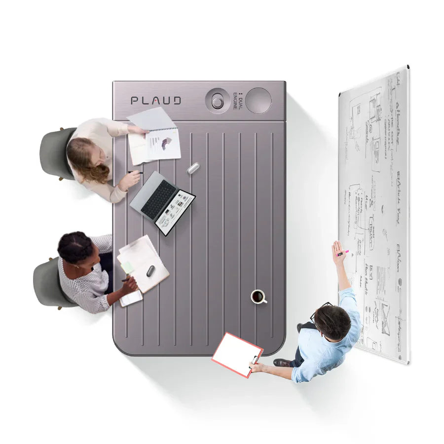 Professionals conduct a meeting around a large table designed to look like a starlight Plaud Note AI voice recorder.