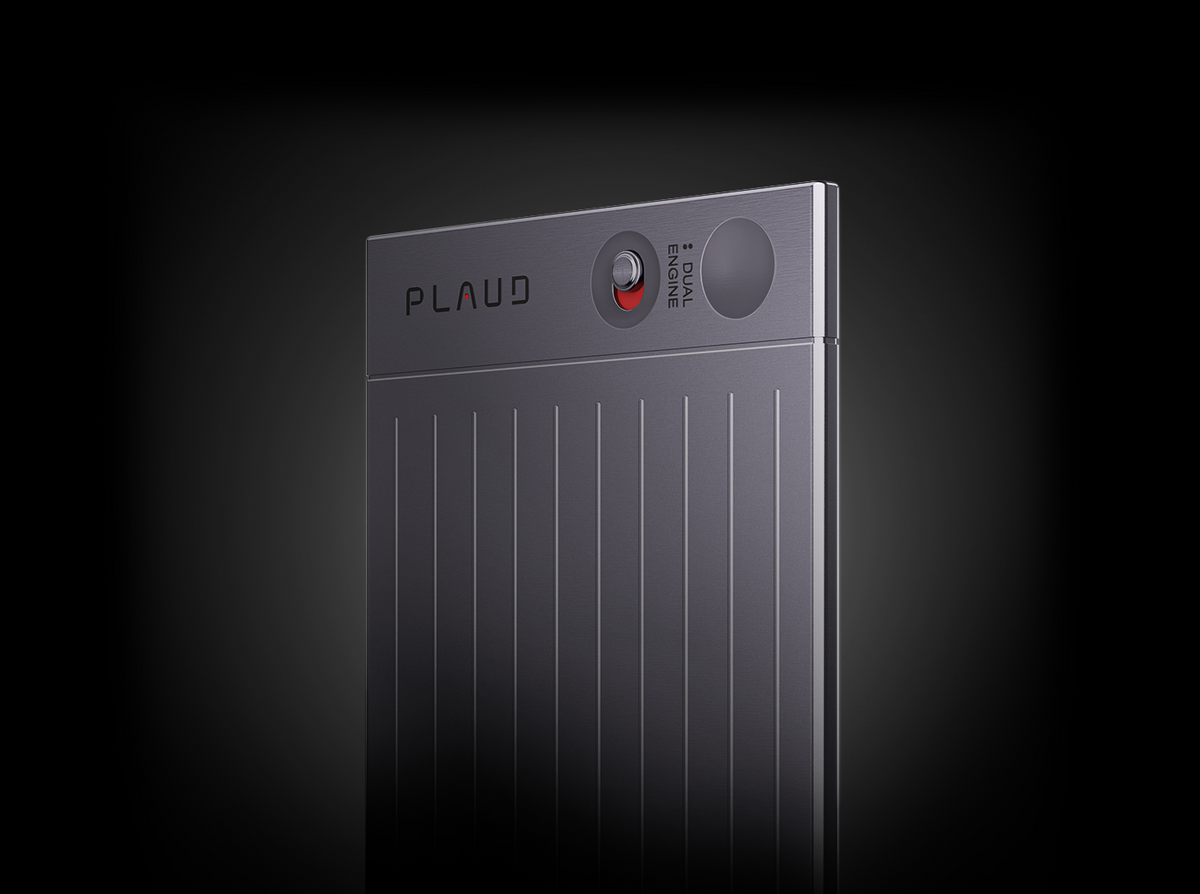 A dark gray Plaud Note AI voice recorder featuring the Plaud logo, a red-dot slide switch, and straight vertical lines.