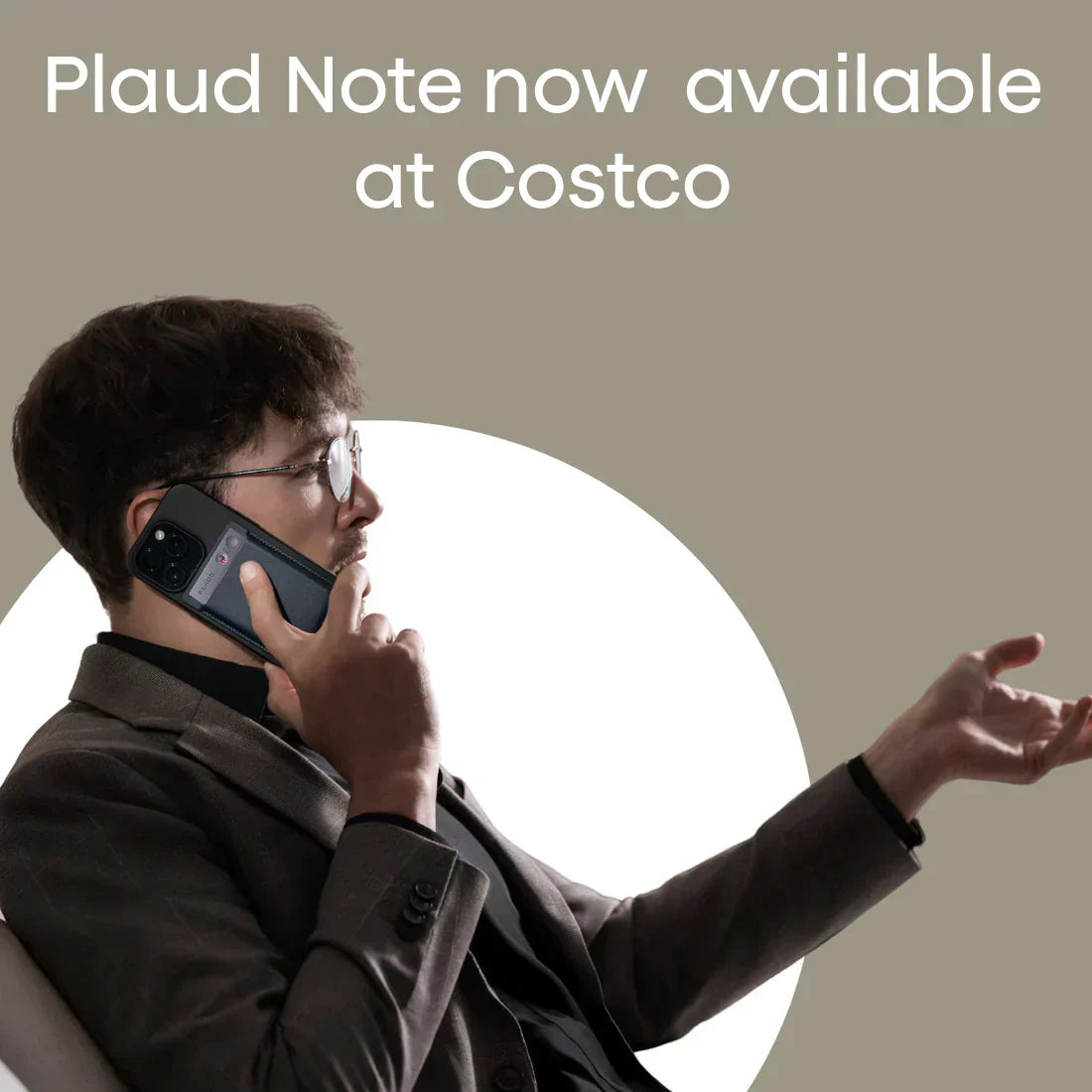 A man in a suit talks on a smartphone with a black Plaud Note attached to the back; text says Plaud Note now available at Costco.
