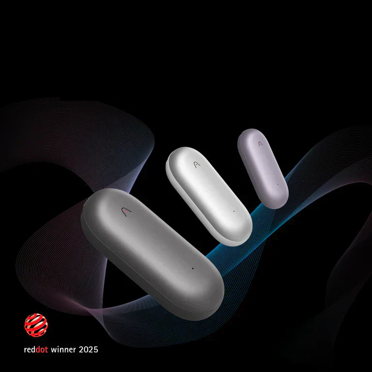 Three Plaud NotePin wearable AI recorders in gray, silver, and purple, labeled as a Red Dot winner 2025.