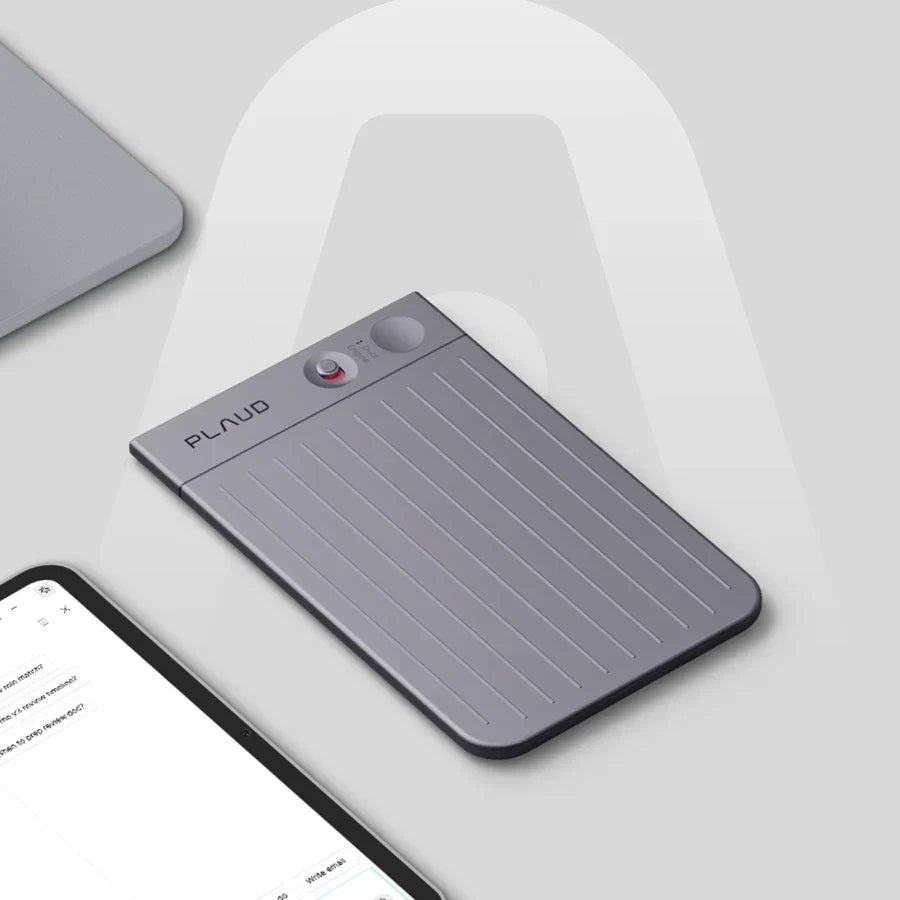 Plaud Note Pro device on a desk next to a laptop and tablet